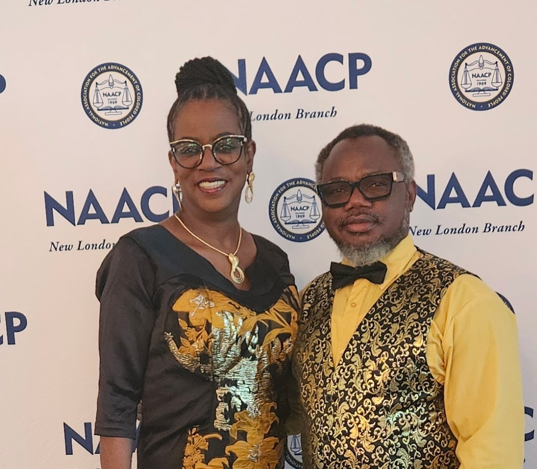 Pastor Adewale and 1st Lady Catherine Olokodana standing in the sanctuary of Missionary Church of Groton